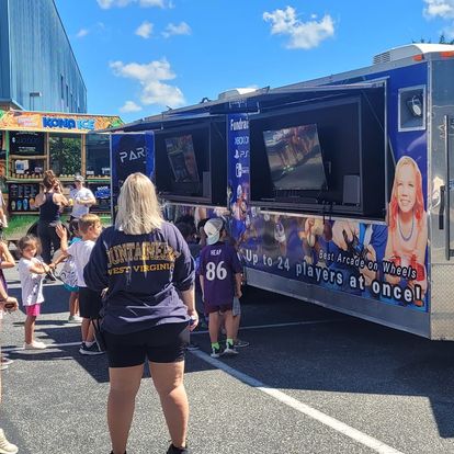 Party Game Truck at event with crowd of kids and parents