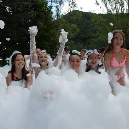 Kids laughing and celebrating in a real Party Game Truck foam party