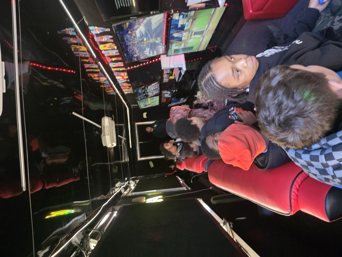 Kids gaming inside truck at night event