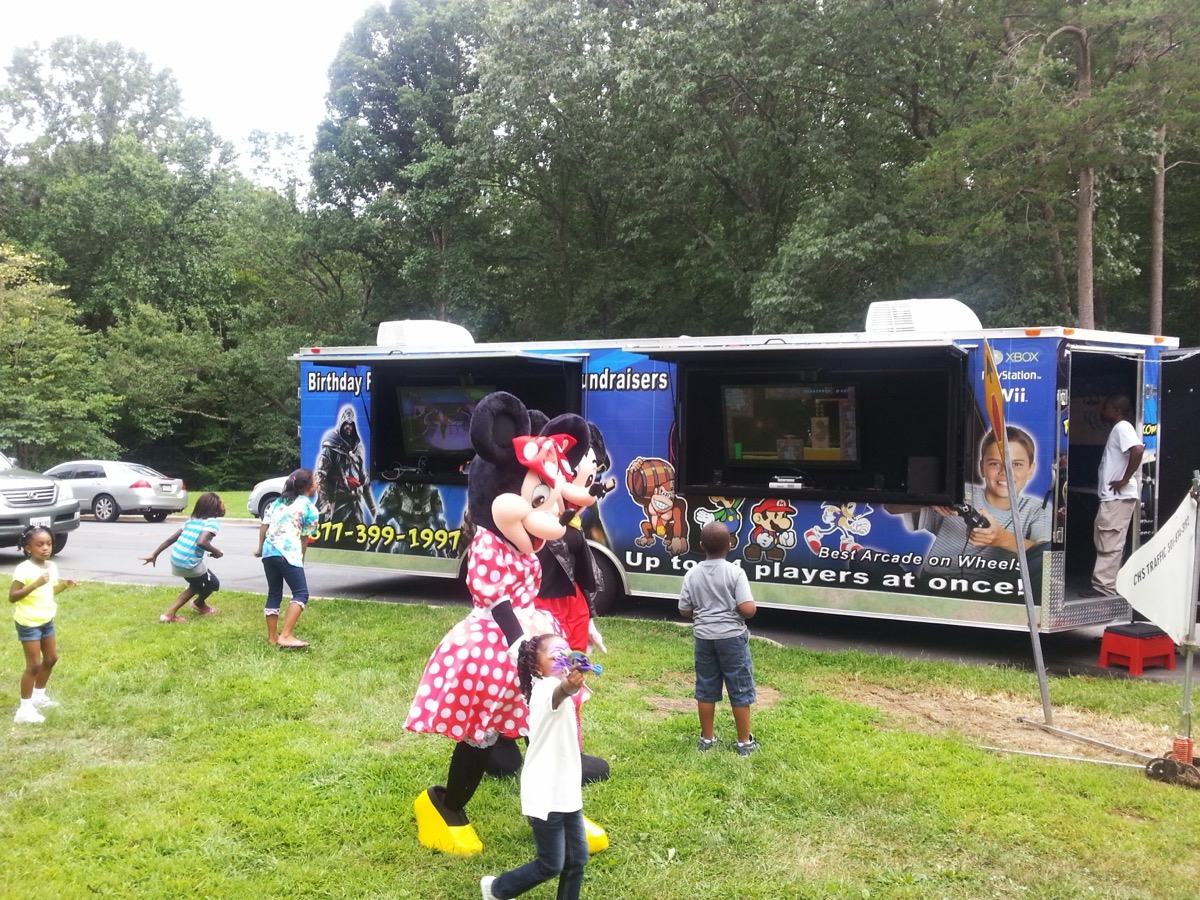Minnie Mouse character with kids at Party Game Truck