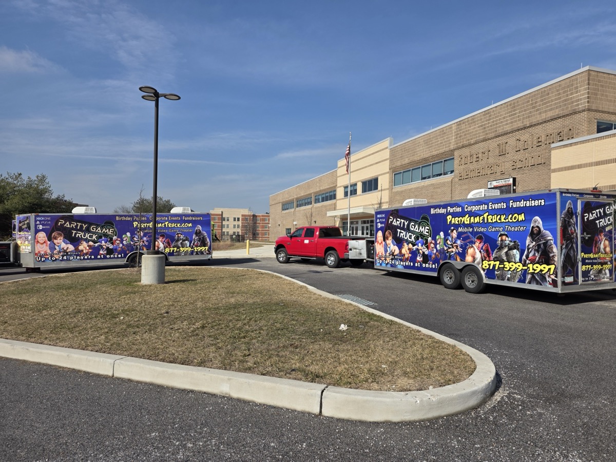 Two trucks at school